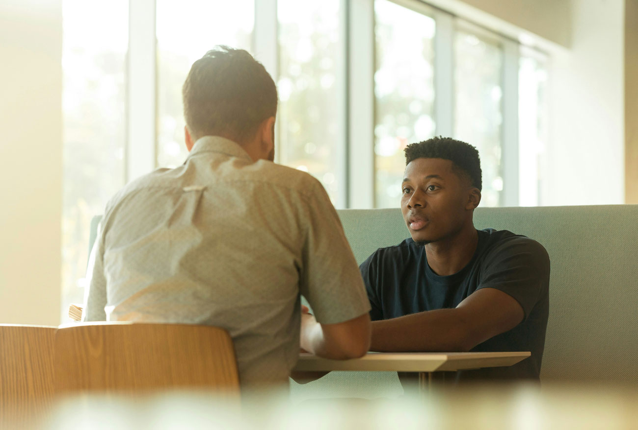 meeting between two male workers