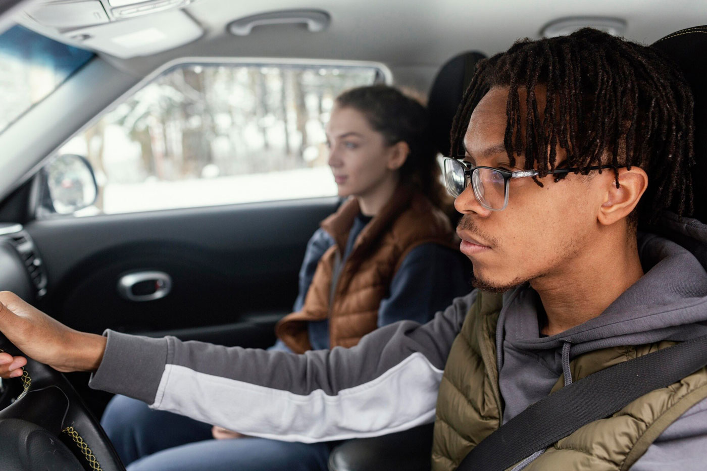 Two teenagers in a car.