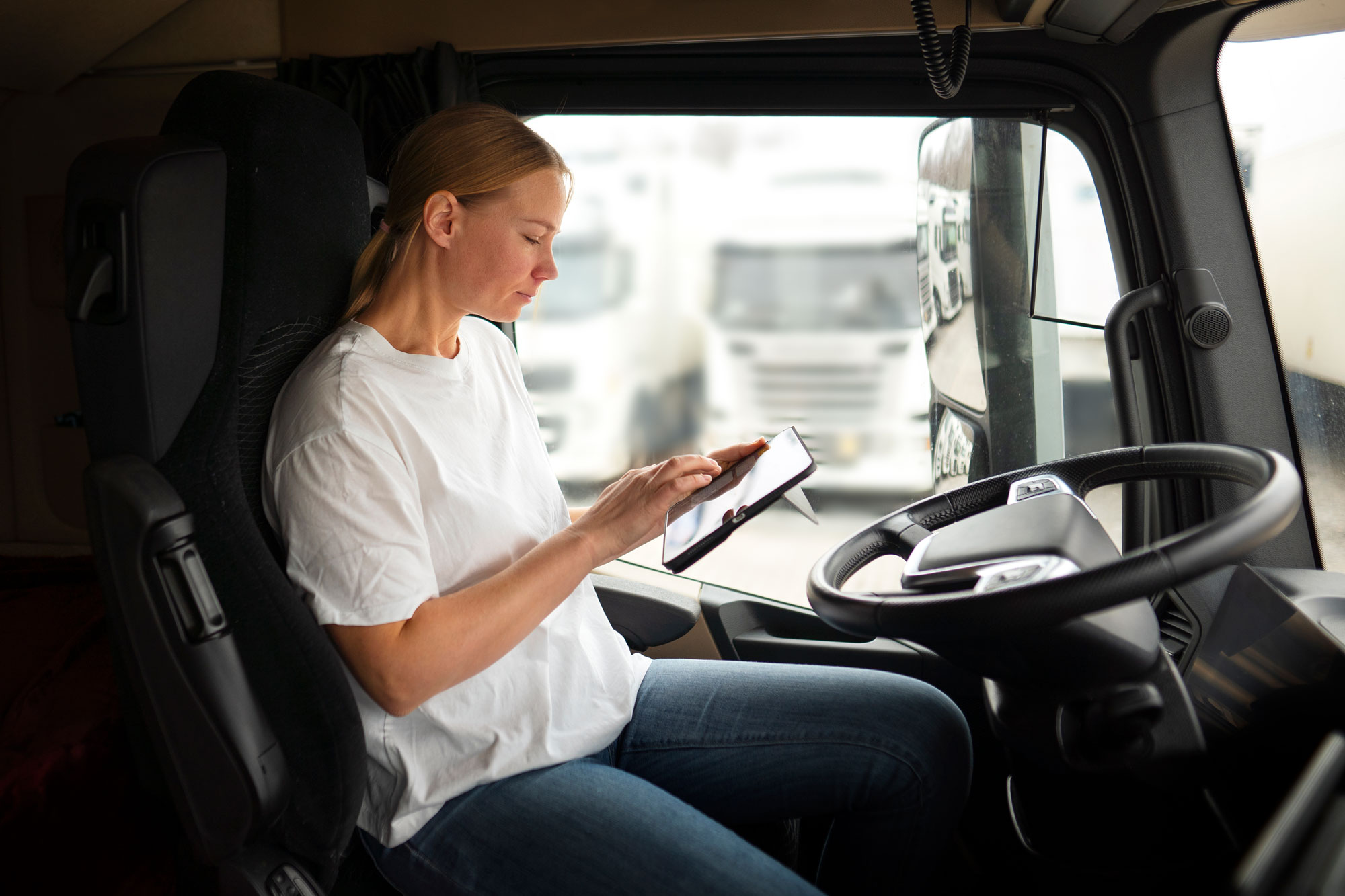 woman on tablet in truck
